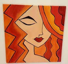 an abstract painting of a woman's face with red hair and orange eyes on a white wall