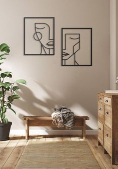 a wooden bench sitting next to a plant in a living room