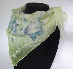 "Hand painted silk chiffon square scarf in shades of green, blue, purple and white. \"Blue Mushroom\" Made with 100% Silk Chiffon. Size: 20x20 inches (50x50 cm) All items are created in a smoke free environment. CARE   Dry clean or hand wash cold with gentle detergent. Iron face down with paper or cloth underneath. Use the iron setting for silk. Do not apply perfume or cologne to the silk as it can damage the colors. SHIPPING All items posted in my shop are available to ship within 1-3 business Green Square Scarf For Spring, Elegant Green Scarf, One Size, Green One Size Scarf As A Gift, Green One-size Scarf As Gift, Green Square Silk Scarf For Spring, Green Silk Scarf For Summer, Green Bohemian Silk Scarf One Size, Apply Perfume, Blue Mushroom