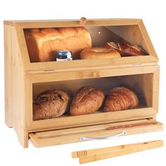 a wooden case with bread and rolls in it