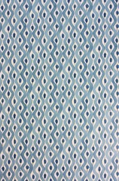 an abstract blue and white pattern on fabric