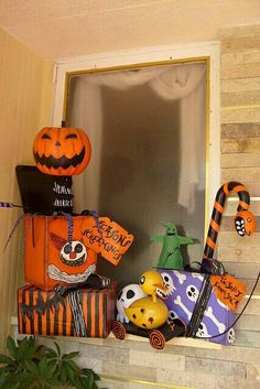 halloween decorations are displayed on the window sill