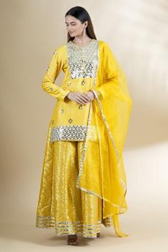 Shop for Neha Khullar Yellow Chanderi Silk Kurta Gharara Set for Women Online at Aza Fashions Designer Festive Sharara With Gota Work, Designer Wear Sharara With Gota Work For Festive Season, Festive Sharara With Mirror Work, Designer Sharara With Mirror Work For Eid, Festive Gota Work Sharara In Chinon, Designer Mirror Work Sharara For Eid, Designer Eid Sharara With Mirror Work, Semi-stitched Sharara With Mirror Work For Festive Occasions, Festive Sharara With Mirror Work And Traditional Drape