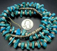 "OLD NAVAJO TURQUOISE and HEISHI NECKLACE DESCRIPTION: This venerable old necklace features tumbled turquoise beads and hand-rolled shell heishi. The strand is finished with a pair of coral beads. This extraordinary necklace will be a valuable addition to your collection of fine vintage Native American jewelry. MEASUREMENTS: Necklace measures 30\" long WEIGHT: 101.1 grams SIGNED: no" Traditional Turquoise Single Strand Necklace With Round Beads, Traditional Turquoise Oval Beads Jewelry, Vintage Turquoise Necklace With Polished Beads, Traditional Turquoise Single Strand Jewelry, Vintage Turquoise Necklace With Polished Beads For Gift, Vintage Blue Necklaces With Oval Beads, Vintage Blue Necklace With Oval Beads, Vintage Blue Oval Bead Necklace, Vintage Turquoise Necklace Hand-strung