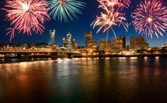 fireworks in the sky over a city and water with an american flag on it that reads wishing you a sparkling fourth of july filled with pride, hon