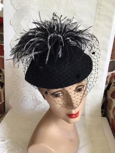 "Vintage 1970's dark Black Wool Felt hat. Has veiling with Black and White feathers. Label is *Miss Bierner*. Made in USA. *MORE INFORMATION BELOW* CONDITION: No issues noted. MEASURES: Inside circumference~21\" Front to back~7\" Left to right~8\" *WE APOLOGIZE~BUT WE NO LONGER SHIP TO GERMANY, ITALY OR SPAIN. IF ORDERS COME IN FROM GERMANY, ITALY OR SPAIN, WE WILL HAVE TO CANCEL THEM AND REFUND YOUR MONEY. SORRY FOR THIS INCONVENIENCE*" Fitted Black Costume Hats For Fall, Fitted Black Costume Hats And Headpieces For Fall, Black Wide Brim Retro Hat, Retro Black Mini Hats For Party, Vintage Black Brimmed Hat, Black Brimmed Retro Hat, Vintage Top Hat For Fall Party, Black Retro Brimmed Hat, Retro Black Hat For Fall