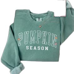 Long Sleeve Tops For School Spirit In Fall, Trendy College Sweats For Fall, Fall School Spirit Relaxed Fit Tops, Relaxed Fit Tops For School Spirit In Fall, Varsity Cotton Sweatshirt For Fall, Varsity Cotton Sweater For Fall, Relaxed Fit Letter Print Sweats For Fall, Trendy Green Sweats For Fall, Fall Crew Neck Sweats With Letter Print