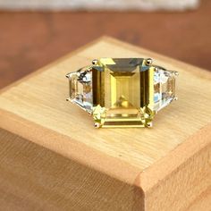 Very large statement ring! Effy Designer 14KT Yellow Gold Citrine and White Topaz Ring Size 7 Can be resized for an additional fee Weight: 5 grams Stone measures: 14mm x 12mm Trapezoid White measures 9.5mm x 6mm x6mm Stamped 14K & hallmarked Effy  Very Good Condition Stunning, interesting piece Check out all our gemstone rings + our entire jewelry collection! Please let us know if you have any questions. Thank you, Legacy Saint Jewelry -OUR RETURN POLICY-  To return an item you must first contact us within 7 days of receiving your item(s). Upon messaging us we will provide the steps in returning or exchanging. The buyer is fully responsible for paying for return shipping. We offer refunds minus $10 or 10% of the item cost (plus any mandatory taxes), whichever is greater will be subtracted Saint Jewelry, White Topaz Rings, Dainty Pendant, Citrine Stone, Small Crosses, Gold Gift, White Band, Hammered Silver, Topaz Ring