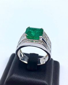 BRAND-NEW!! ONE OF A KIND, HANDCRAFTED RING. EXQUISITE AND FINE CRAFTSMANSHIP! HANDMADE TO LAST FOR AN ETERNITY!! HEIRLOOM PIECE!! PRECIOUS JEWELRY TO BE PASSED ON! PERFECT DRESS RING FOR A GENTLEMAN! 7.02 total carat weight, Certified, Natural emerald ring. This ring offers an important statement of who you are with a 4.76 carats, VIVID GREEN, transparent, ZAMBIAN EMERALD. Accentuating the EMERALD are the 48 SUBSTANTIAL F/VS, sparkling natural diamonds! Set in one of a kind, handmade 18K Solid Luxury Green Emerald Ring For Men, Luxury Green Signet Ring For Formal Occasions, Classic Gia Certified Signet Ring For Formal Occasions, Formal Wide Band Gemstone Ring, Wide Band Gemstone Rings For Formal Occasions, Luxury Hallmarked Emerald Cut Signet Ring, Formal White Gold Gia Certified Signet Ring, Formal Gia Certified White Gold Signet Ring, Luxury Baguette Cut Signet Ring For Formal Occasions