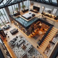 an aerial view of a living room, dining area and bedroom from the top floor