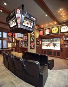 this is an image of a game room with many sports memorabilia on the walls and ceiling