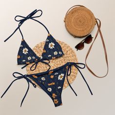 The trendy navy blue triangle bikini set with meadow flowers gives bohemian vibes. The lining is navy blue. Perfect boho-chic bikini is available in sizes up to 6XL. Straps can be tied in multiple ways. This design on the bikini top and bottom are also sold separately. Please check the sizing chart between the listing photos. Item description: - fabric composition in Latvia: 88% recycled polyester, 12% elastane, - fabric composition in Mexico: 81% recycled polyester, 19% Lycra spandex, - soft an Bohemian Blue Swimwear With Floral Print, Summer Navy Triangle Top Swimwear, Navy Summer Swimwear For Beach Party, Bohemian Blue Floral Print Swimwear, Navy Swimwear For Summer Beach Party, Navy Triangle Top Swimwear For Summer, Navy Swimwear For Beach Party In Summer, Summer Style Navy Triangle Top Swimwear, Navy Swimwear For Summer Vacation