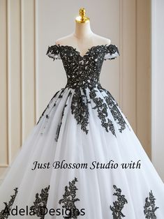 a white and black wedding dress on a mannequin