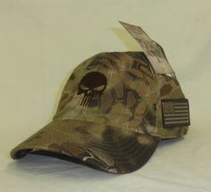 In stock brand new Adult size BLACK ON BLACK COTTON BALL CAP , ADJUSTABLE LOW PROFILE COTTON. HOOK N LOOP BUCKLE STRAP CLOSURE, NO STIFF FRONT Kryptek Highlander Tactical Brown camo with Brown Punisher ball cap - one size fits most adults low profile hat - 6 panel no stiff front ...No top button to interfere with headset, micro D hook and loop Velcro adjustment , left side Tonal flag, Q3 moisture wicking sweatband, Velcro adjustable. BLACK ON BLACK PUNISHER CAP WITH FLAG. KHAKI CAP BLACK PUNISHE Adjustable Tactical Cap, Black Punisher, Skull Punisher, Punisher Logo, Veteran Hats, Police Hat, Tactical Hat, Brown Embroidery, Navy Hat