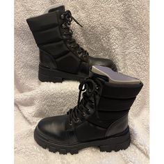 The Amita Hiker Booties From Marc Fisher Have An Exaggerated Lug Sole, Puffed Nylon Upper And Lace Up Detailing That Perfectly Tie Together Any Cool-Weather Ensemble. Heel Height - 2.17" Shaft Height - 5.71", Calf Circumference - 9.84" Shoe Width - Medium Zipper Closure Faux Leather Upper, Textile And Manmade Lining, Manmade And Leather Sole Round Toe Faux Leather Spot Clean Imported Black Closed Toe Mid-calf Boots For Winter, Black Moto Boots With Padded Ankle For Winter, Moto Boots With Padded Ankle, Round Toe, Medium Width, Outdoor Platform Boots With Padded Ankle And Round Toe, Moto Boots With Padded Ankle And Round Toe, Moto Boots With Padded Ankle And Medium Width, Black Lace-up Boots With Padded Ankle And Round Toe, Winter Lace-up Moto Boots With Padded Ankle, Winter Combat Boots With Reinforced Heel