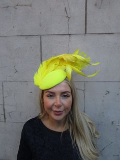 This hat is perfect for special occasions. Featuring feather detailing. The bottom of the hat is approximately 15cm across. This comes on a headband  One off piece - only one available! Many more items like this are available in our shop! Made in the UK - Yellow Church Fascinator With Short Brim, Yellow Short Brim Fascinator For Church, Elegant Flat Cap For Party, Yellow Mini Hat With Curved Brim For Party, Yellow Curved Brim Fascinator For Party, Adjustable Flat Cap Mini Hats For Party, Adjustable Flat Cap For Parties, Yellow Party Headband Costume Accessory, Kentucky Derby Fitted Felt Hat For Party