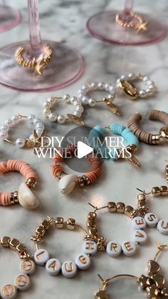 wine charms are sitting on a marble table