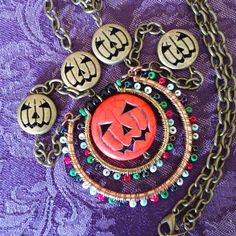 Super Festive Fall/Halloween Pumpkin Charm Necklace. Brass Chain With Pumpkin Accents! Focal Point Charm Is An Orange Pumpkin Face With Colorful Seed Beads Accents. Unique Necklace, You Won't See Anyone Else Wearing This! 59 Halloween Metal Necklace With Adjustable Chain, Metal Necklaces With Lobster Clasp For Halloween, Metal Necklace With Lobster Clasp For Halloween, Red Novelty Jewelry For Halloween, Metal Jewelry For Halloween Festival, Metal Halloween Jewelry, Metal Halloween Festival Jewelry, Bohemian Jewelry For Halloween Party, Bohemian Halloween Party Jewelry