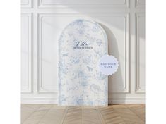 a white and blue floral arch with a label on it