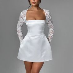 Elevate your style with this sophisticated A-line mini dress, crafted from luxurious satin. Its fit and flare silhouette ensures a flattering shape, while delicate lace sleeves add a touch of femininity. The square neckline offers a modern twist, and it comes in stunning white, classic black, and vibrant blue. Color: W Backless Short Dress, White Satin Dress, Elegante Y Chic, Dinner Dates, Maxi Dress Sale, Summer Lace, White Dress Party, Lace Dress With Sleeves, Romantic Dinner