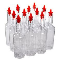 many empty bottles with red caps on them