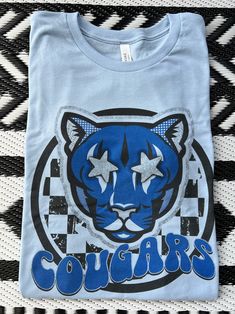 Here's a tee made just for you -- this Preppy Cougars tee is super soft and comfy. Shown on heather aqua, but so many colors to choose from. Who will you be rooting for? Design made on unisex Bella Canvas shirts. More mascot shirts available in my shop. Blue T-shirt With Sublimation Print For Game Day, Blue School Spirit T-shirt With Sublimation Print, Blue T-shirt With Sublimation Print For School Spirit, Light Blue Graphic Tee With Graphic Print, Blue Relaxed Fit T-shirt For School Spirit, Light Blue Graphic T-shirt, Blue Graphic Print T-shirt For School Spirit, Blue School Spirit T-shirt With Screen Print, Blue Tri-blend T-shirt With Screen Print