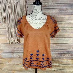 Scoop Neck, Keyhole Back. All-Over Embroidered Design. Color: Burnt Orange/Navy Measurements: Bust 36” Length 23” Please Note That This Fabric Looks Like It Has Piling But This Is By Design Of The Fabric. O30 Embroidered Orange V-neck Tops, Orange Short Sleeve Tops With Floral Embroidery, Orange Embroidered V-neck Top, Orange Floral Embroidered Short Sleeve Tops, Orange Floral Embroidery Short Sleeve Tops, Orange Embroidered Beach Top, Orange Embroidered Top For Beach, Embroidered Cotton Top, Light Pink Shorts