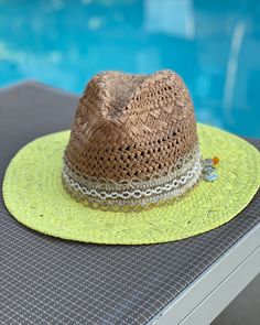 These are one of a kind Panama Hats! Featuring a hand painted brim, a unique and delicate hat ribbon, finished with cute little charms to brighten your day! The hat is constructed from 100% paper styled in a patterned weave accent. So super cute for the pool, the beach, bbq's, wine tasting, happy hour and more!! Makes a very special gift as well.Approx Measurements:Circumference: 22"Crown Height: 5.25"Brim: 3"100% Recycled Paper Unique Beach, Beach Hat, Sunny Day, Brighten Your Day, Wine Tasting, The Pool, Recycled Paper, Happy Hour, Special Gift