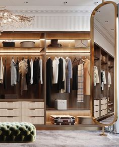 a walk in closet filled with lots of clothes