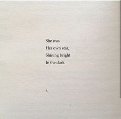 an old book with the words she was her own star, shining bright in the dark