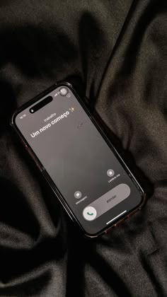 an iphone with the text unplugged on it sitting on a black cloth