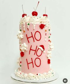 a pink birthday cake with the word ho ho written on it