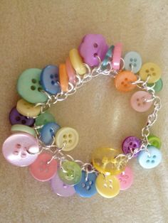 a bracelet with lots of different colored buttons