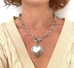 Make a bold statement with this chunky silver heart necklace, featuring a thick chain and an oversized heart-shaped pendant. This piece of statement jewelry exudes contemporary elegance and is perfect for adding a touch of glamour to any outfit. Whether worn alone or layered with other pieces, this necklace is sure to stand out and make an impact. 🔸 In the photo, the model wears a necklace length of 18" / 46 cm. MADE OF: All my pieces are made of silver-plated Zamak. Have a 100% European qualit Trendy Silver Heart Chain Necklace, Chunky Metal Necklace With Heart Pendant, Chunky Metal Heart Pendant Necklace, Trendy Chunky Chain Heart Pendant Necklace, Trendy Chunky Chain Necklace With Heart Pendant, Silver Heart Necklace With Chunky Chain, Trendy Silver Heart Necklace With Chunky Chain, Silver Heart Necklace With Chunky Chain For Gifts, Chunky Heart Pendant Necklace For Valentine's Day