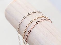 Our Small Paperclip chain has elongated links measuring 2.25 x 5mm in 14k gold filled, sterling silver and rose gold filled metals. Our favorite laying combo is a the Paperclip as a texture, then add a straight line chain like the Curb Chain. Lengths Bracelets: 6", 7", 8" with a .5" adjustable ending Anklets: 7", 8", 9", 10" with a 1" adjustable ending Necklaces:: 14", 16", 18" with a 1.5" adjustable ending Packaged in our logo stamped gift boxes, ready for gift giving. Layering chains are cut f Layering Chains, Straight Line, Logo Stamp, Curb Chain, Paper Clip, Gift Boxes, Chain Lengths, Anklets, Gold Filled