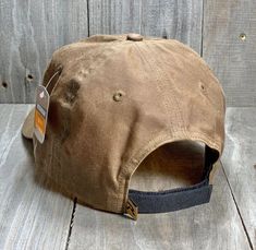 Solid Buck Waxed Cap This is the perfect Waxed Cap for hunting your favorite Waterfowl during those nasty, drizzly, rainy days. Weather-inspired functionality. This traditional, waxed cotton cap repels water to help keep you dry while in the elements. SHAPE Relaxed Unstructured FABRIC Waxed/Oil Cloth VISOR Precurved SWEATBAND Cotton R-ACTIVE FUNCTION: WATER REPELLENTFIT & SIZE OSFM (7 – 7 3/4) Adjustable Hook-and-Loop Backstrap Waterproof Brown Hats For Outdoor Activities, Waterproof Brown Hat For Outdoor Activities, Waterproof Brown Hat For Outdoor, Brown Cotton Baseball Cap For Outdoor Activities, Adjustable Waterproof Brown Hats, Adjustable Brown Waterproof Hats, Rugged Brown Cotton Hat, Country Style Baseball Cap For Outdoor, Rugged Outdoor Hats With Waxed Finish