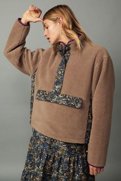 It's time to get cozy, and this relaxed-fit reversible pullover is the perfect place to start. It's like two jackets in one, designed with plush sherpa fleece on one side and a groovy floral-print woven on the other. Snap buttons fasten the half placket, and adjustable bungees draw in the hem for a personalized fit that keeps the cold out. •Reversible •Stand collar •Half placket with snap closures •Zip front on floral print side •Front kangaroo pocket •Contrast panel at sides •Adjustable bungees Teddy Bear Jacket, Coat Trends, Sherpa Hoodie, Teddy Jacket, Sherpa Jacket, Sherpa Fleece, Faux Fur Jacket, Getting Cozy, Puffer Coat