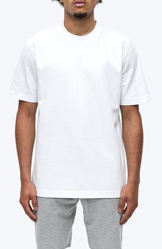 Exposed seams and a roomy, oversized fit define a T-shirt that's crafted for comfort from soft, midweight cotton jersey. 28" length (size Medium) Crewneck Short sleeves Smooth flatlock seaming designed to eliminate rubbing and irritation 100% cotton Machine wash, tumble dry Imported Reigning Champ, Summer Wardrobe Essentials, Exposed Seams, Sports Blazer, Baby Boy Shoes, Made Clothing, Boy Shoes, Inspiration For Kids, Short Suit