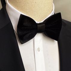 With this rich look, Smoked Velvet Bowtie takes your elegance one step further.. Dimensions: 6 cm * 12 cm Bowtie Reference, Classic Black Bow Tie For Groom, Black Bow Tie For Groom, Classic Black Ribbon Bow Tie For Wedding, Formal Ribbon Bow Tie, Elegant Black Velvet Tuxedo, Luxury Black Velvet Tuxedo, Black Tie Event Ribbon Ties, Elegant Black Ties For Groom