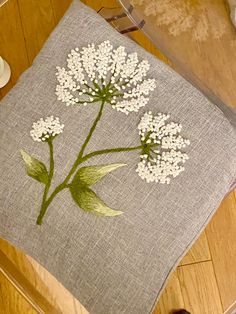 there is a cushion with flowers on it