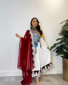 Our Afghan dress is a stunning piece of clothing that celebrates the beauty of traditional Afghan embroidery. The dress is handcrafted by skilled artisans who specialize in the intricate Charma embroidery style. The Charma embroidery is a unique style that has been passed down for generations and is known for its detailed patterns and vibrant colors. The dress features a long skirt that flows beautifully, adding elegance and grace to the overall look. The length of the dress can be customized to Afghan Embroidery, Afghan Wedding Dress, Afghan Culture, Afghani Clothes, Afghan Dress, Afghan Wedding, Punjabi Outfits, Afghan Fashion, Afghan Clothes