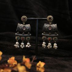 Experience the bold beauty of our Oxidized Dual Tone Earrings with Multi Color Stones. Each unique piece is intricately crafted to showcase the captivating combination of colors and textures. Elevate your style and make a statement with the vibrant energy of these earrings. Combination Of Colors, Organza Sarees, Color Stones, Vibrant Energy, Tussar Silk Saree, Finger Rings, Accessories Jewelry Earrings, Elevate Your Style, Cotton Saree