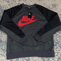 New Nike Graphic Hybrid Crew Neck Sweater Size: Xlarge Color: Grey Black Red Brand New With Tags Nike Crew Neck Outerwear For Fall, Nike Gray Sweatshirt For Streetwear, Black Crew Neck Sweatshirt For Outdoor, Nike Crew Neck Sweatshirt For Outdoor, Nike Gray Tops For Fall, Nike Gray Tops With Ribbed Cuffs, Nike Gray Outerwear With Ribbed Cuffs, Nike Casual Outerwear With Crew Neck, Nike Gray Long Sleeve Sweatshirt