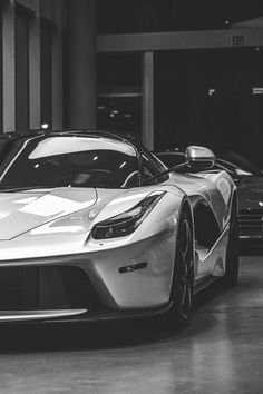 a silver sports car parked in a garage