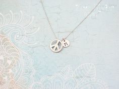 Personalized silver peace sign necklace. Choose letter/initial from the drop-down list above. This elegant peace sign has a smooth semi matte/satin finish, and hangs on a fine dainty chain.DETAILS :* Tiny peace charm measures 1/3" (9mm)* Chain length is 18 inches (45cm) * I am always happy to make your chain longer or shorter, free of charge. Simply write a note at the checkout. Your Zoe River jewelry will arrive gift-wrapped and in a sweet little organza giftbag, carefully packaged to arrive sa Symbolic Silver Jewelry With Peace Sign, Silver Peace Sign Jewelry Gift, Adjustable Sterling Silver Peace Sign Jewelry, Cat Necklace Gold, Peace Necklace, Peace Sign Necklace, Mother Daughter Necklace, Sign Necklace, Silver Mermaid