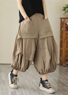 Khaki Elastic Waist Cozy Wide Leg Pants High Waist Khaki Harem Pants With Pockets, High-waist Khaki Harem Pants With Pockets, Khaki High-waist Harem Pants With Pockets, High Waist Baggy Khaki Harem Pants, Baggy High Waist Khaki Harem Pants, Baggy Khaki Pants For Fall, Spring Cargo Style Wide Leg Harem Pants, Khaki Cargo Style Bottoms For Fall, Trendy Baggy Khaki Bottoms