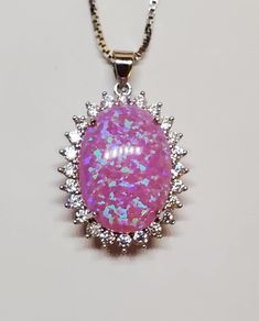 "Pretty Pink Fire Opal Necklace, Big 13x18mm Lab Created Opal With Blue Fire, See Video! 925 Sterling Silver Crystal Halo Pendant, 20\" Sterling Chain. Chain Length Options Available By Messaging Seller At Time Of Purchase. Gift Box Included." Sterling Silver Jewelry With Shiny Finish And Oval Shape, Oval Sterling Silver Jewelry With Shiny Finish, Oval Silver Jewelry With Shiny Finish, Pink Oval Sterling Silver Jewelry, Oval Pink Sterling Silver Jewelry, Formal Pink Cabochon Necklace, Pink Oval Jewelry Stamped 925, Dazzling Oval Silver Necklace, Dazzling Sterling Silver Oval Pendant Necklace