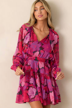 Elevate your style with the luxurious MINKPINK Lexie Pink Floral Dress. This stunning mini dress features a gorgeous floral print and long sleeves for added sophistication. Perfect for any occasion, this dress will make you feel confident and chic all day long. This pink dress features a v neck, flowy and breezy sleeves , a tie front detail and a smocked waistband. September Style, September Fashion, Halter Bridesmaid Dress, Rush Dresses, Style Edit, Pink Floral Dress, Black Dresses Casual, Little White Dresses, Mink Pink