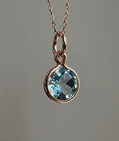 Wonderful natural aquamarine set in solid  14k yellow gold setting.  The gemstone sparkles beautifully and has a very good cut.  VVS clarity! This genuine aquamarine measures 4mm and weighs 0.60 carat. Total pendant weight is 0.35 grams Pendant length (including jump ring) - 15 mm *chain is not included The item shown in the photos is the exact item you will receive upon purchase. Double check dimensions and weight of item to make sure it meets your specifications before ordering. Each piece has Aquamarine Pendant, March Birthstone, Yellow Gold Setting, Natural Aquamarine, March Birth Stone, Pendant Set, Necklace Bracelet, Aquamarine, Charm Necklace