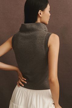 70% polyester, 30% viscose; 64% polyester, 28% viscose, 8% elastane rib Pullover styling Machine wash Imported | Cowl-Neck Muscle Knit Tank Top by Maeve in Grey, Women's, Size: Medium, Polyester/Viscose/Elastane at Anthropologie Versatile Ribbed Knit Top For Layering, Stretch Knit Turtleneck Top, Stretch Textured Knit Tops For Layering, Versatile Ribbed Turtleneck Tops, Stretch Turtleneck Knit Top For Layering, Chic Knit Top For Fall, Chic Fall Knit Top, Chic Stretch Knit Top With Ribbed Neckline, Funnel Neck Top For Loungewear